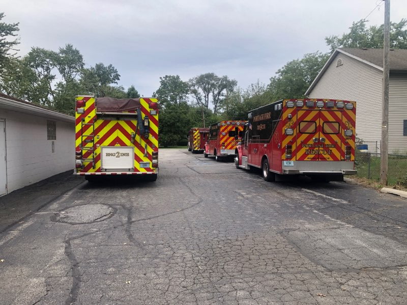 Portage Fire Department engine and rescue trucks parked behind VFW Post 7760