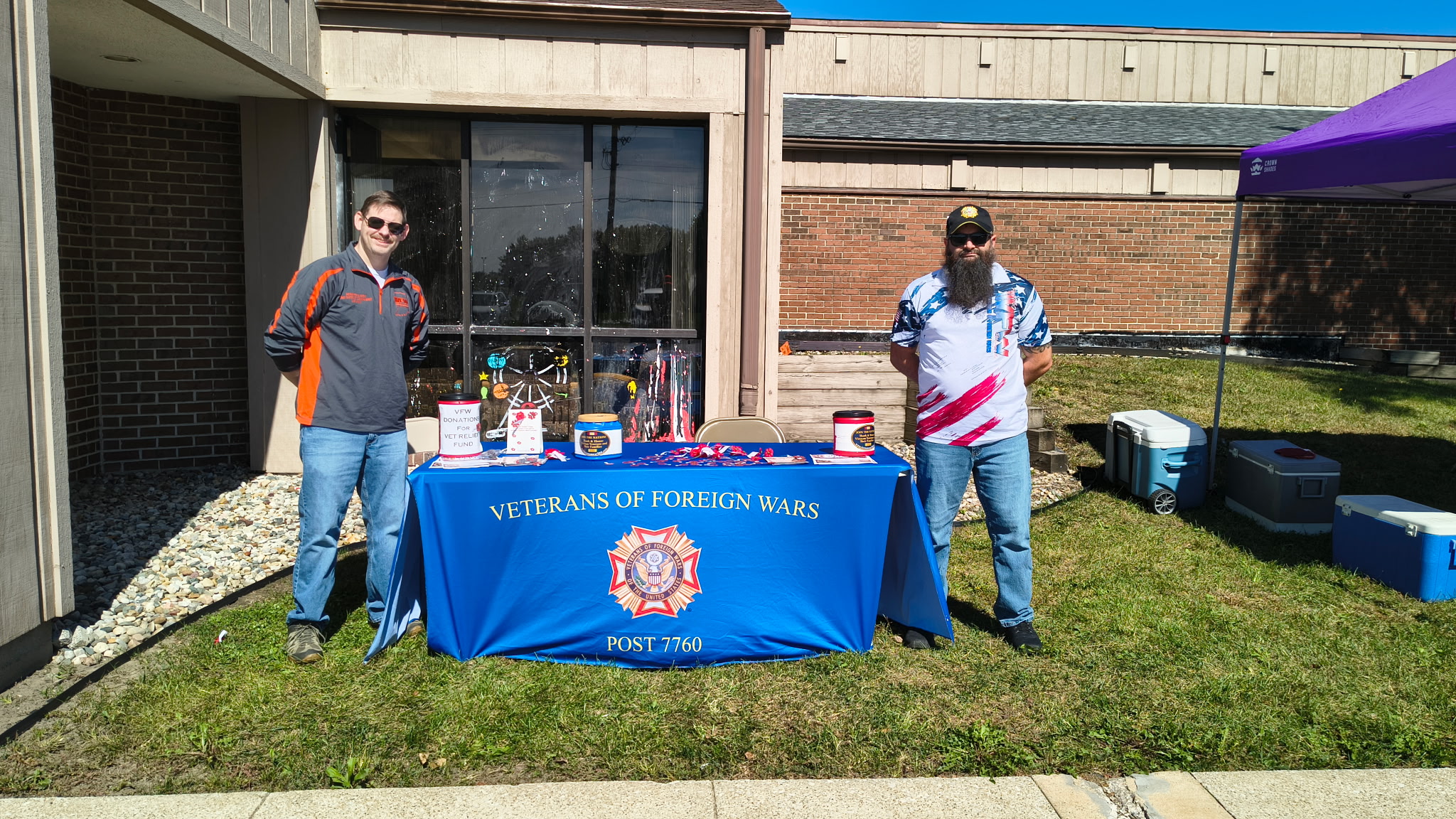 VFW Post 7760 members manning the Veterans Relief Fund donation table at Hogs For Hope