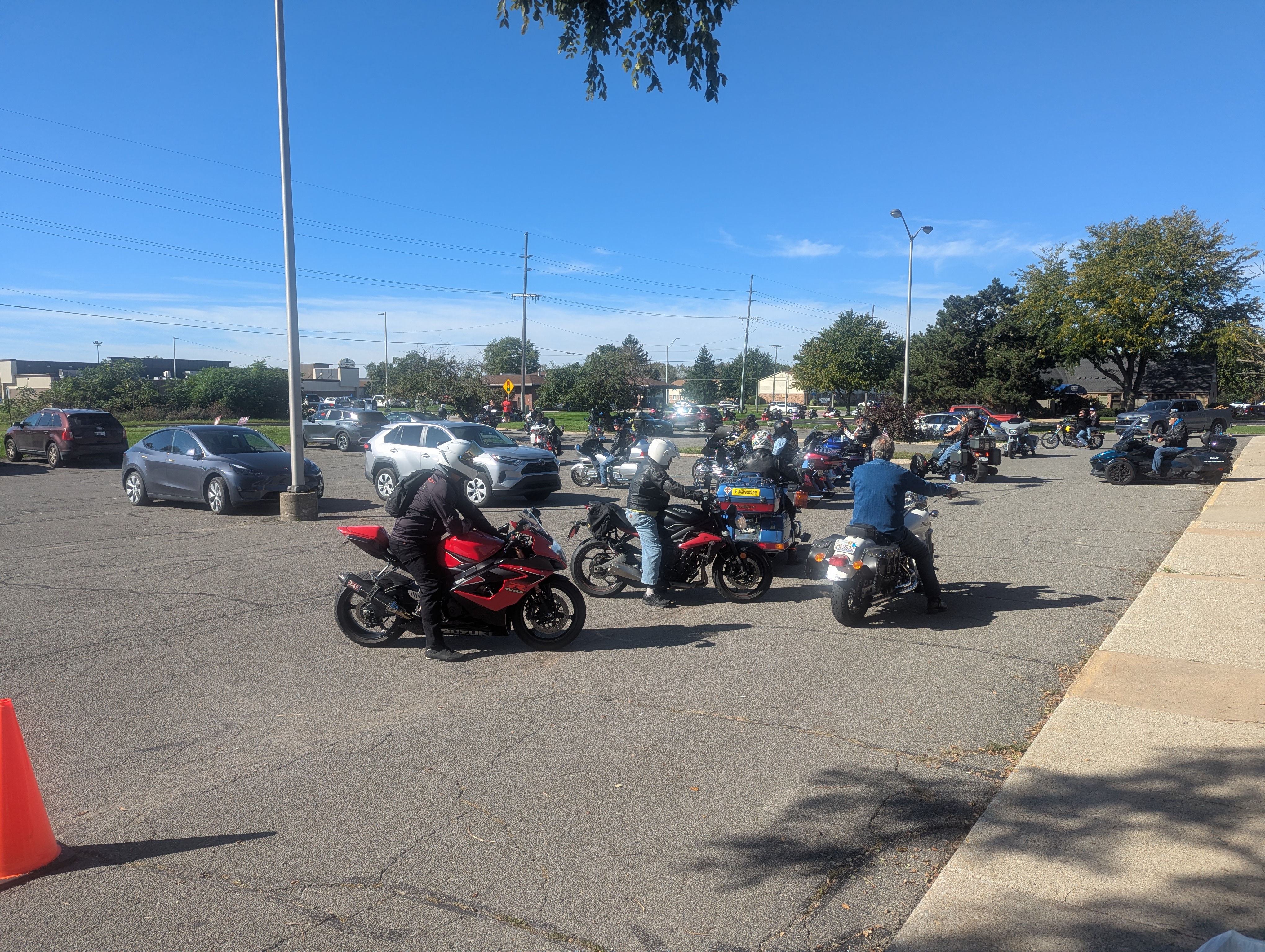Riders staging in the parking lot at the Hogs For Hope charity motorcycle ride